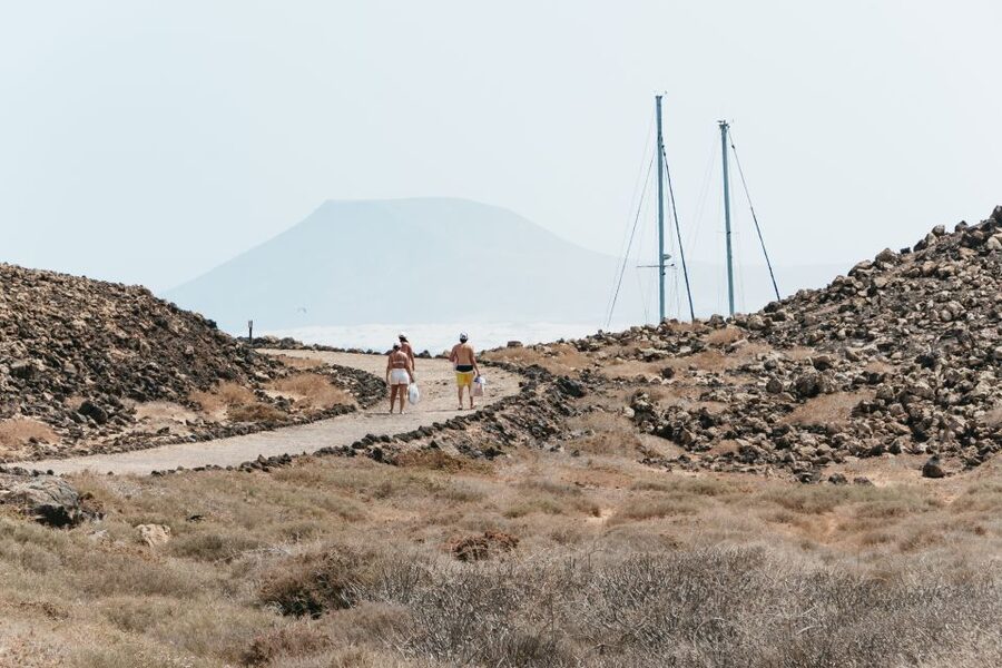 Corralejo: Return Ferry Ticket to Lobos Island Fuerteventura - Walking toward Faro de Lobos