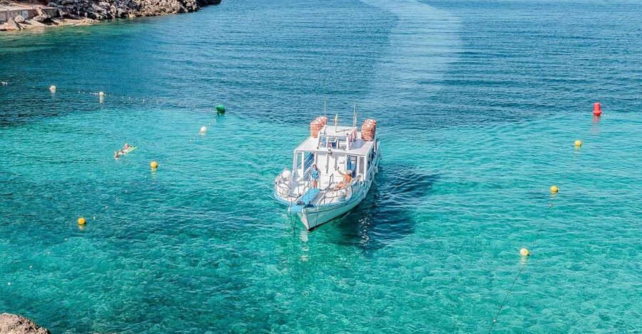 Sant Antoni: Round-Trip Ferry Transfer to Cala Salada Beach - Leaving Sant Antoni beside the Palapa bar