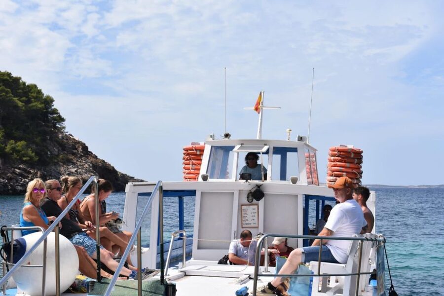 Sant Antoni: Round-Trip Ferry Transfer to Cala Salada Beach - Booking, cancellation, and language details