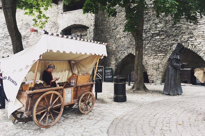 Tallinn Day Tour from Helsinki (Ferry Tickets+ Guiding+ Own Time) - Town Hall and Town Hall Pharmacy reveal everyday Tallinn