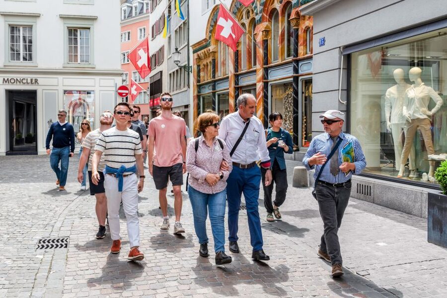 Zurich: City Highlights Tour by Bus, Cable Car, and Ferry - Old Town churches, clocks, and guild houses